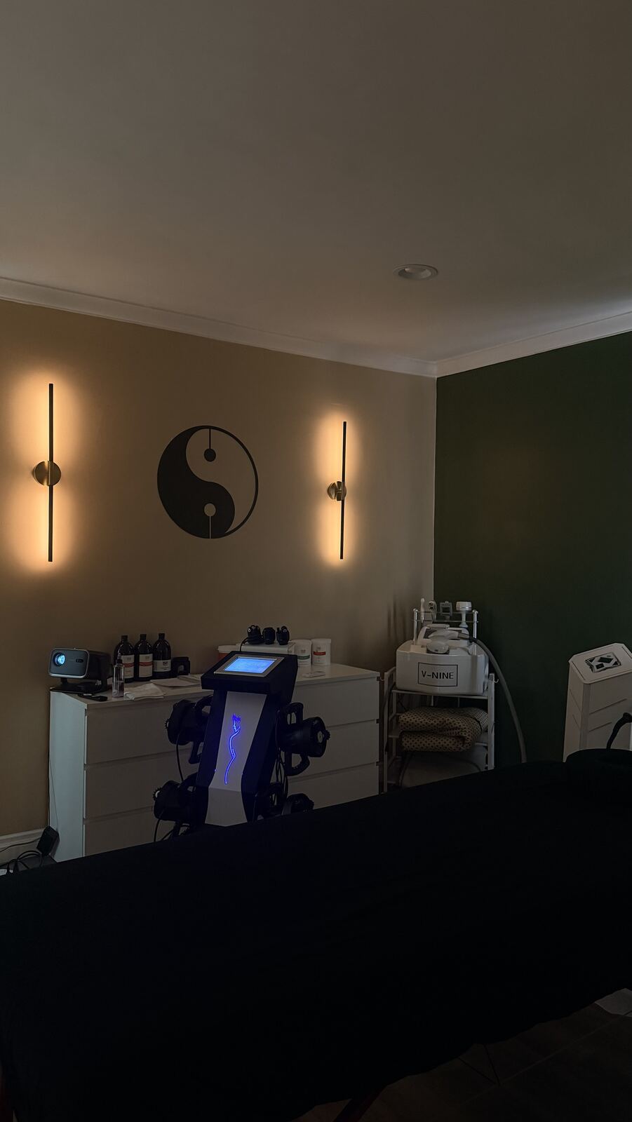 Treatment room in evening lighting with warm wall lights